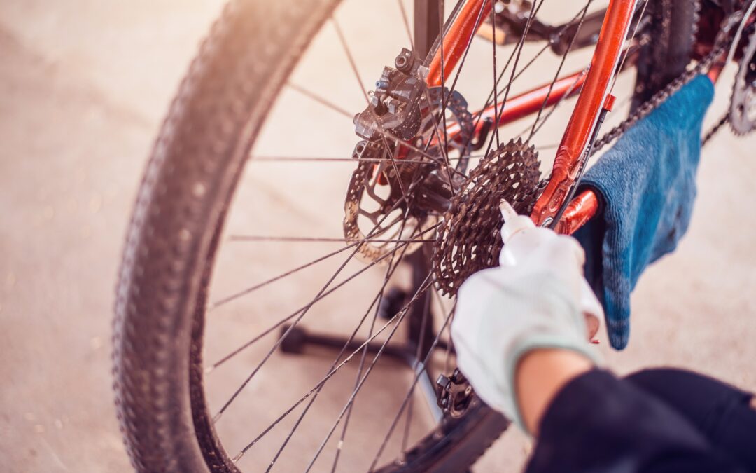 Person applying oil to a bicycle chain