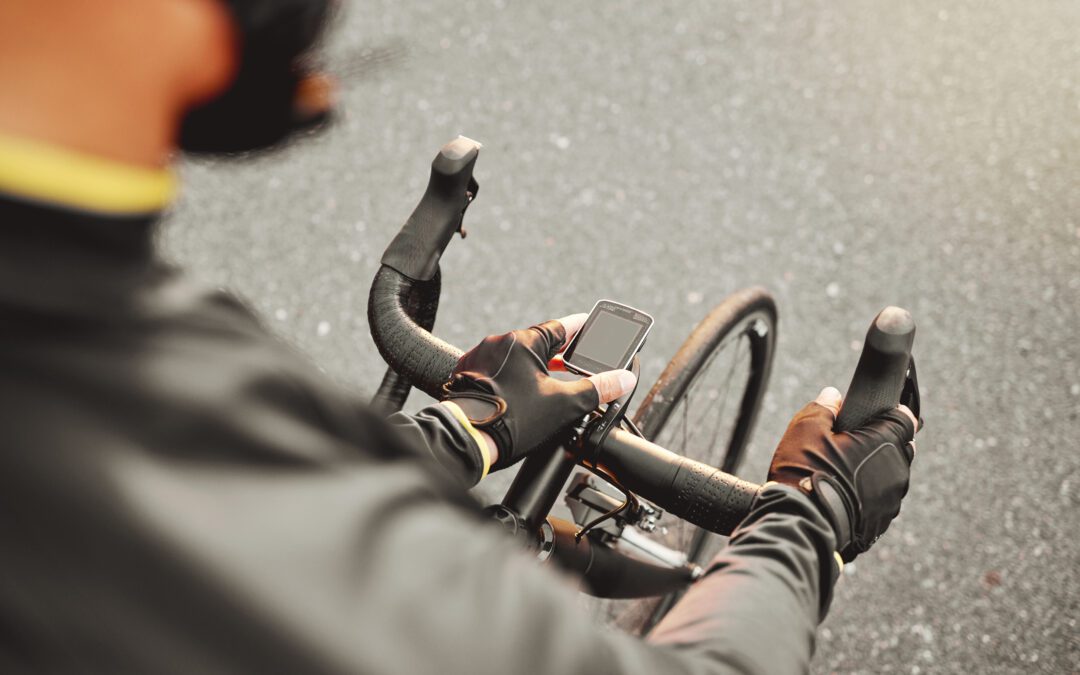 Cycling, fitness and sport technology ride tracker of a cyclist on a bike after road training. Training, bicycle exercise time and bike workout of a person doing healthy cardio and sports health